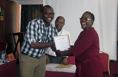 A participant receives a certificate for attending the workshop